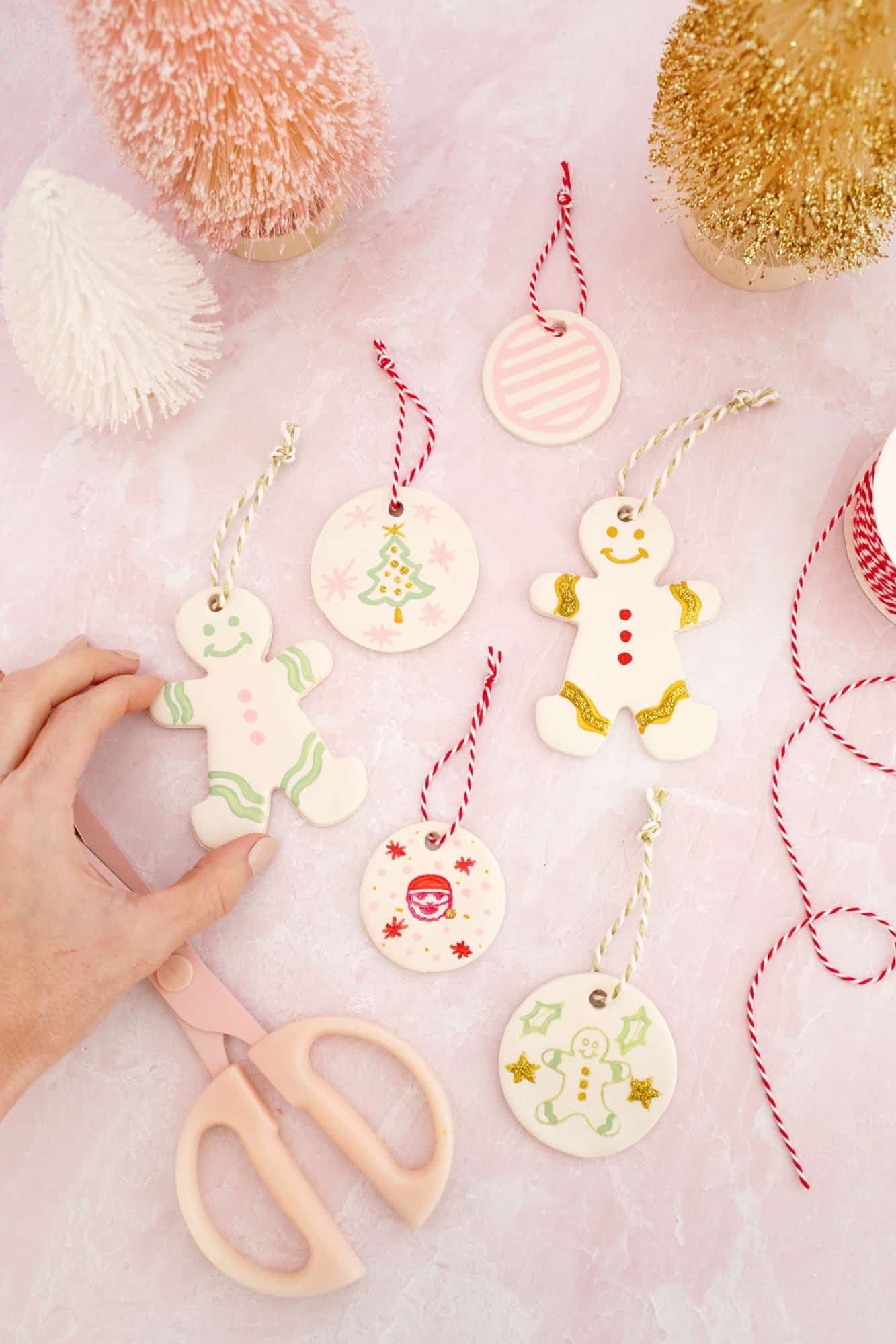 painted gingerbread people and circle ornaments made from clay