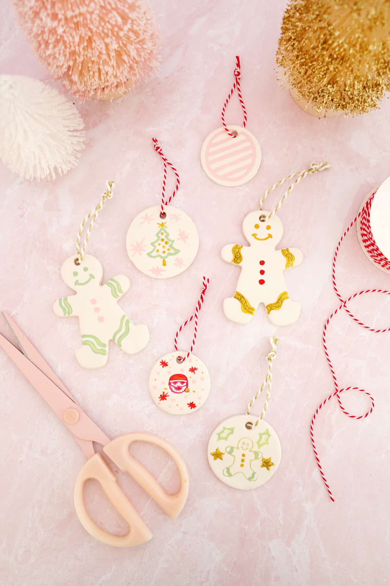 painted gingerbread people and circle ornaments made from clay